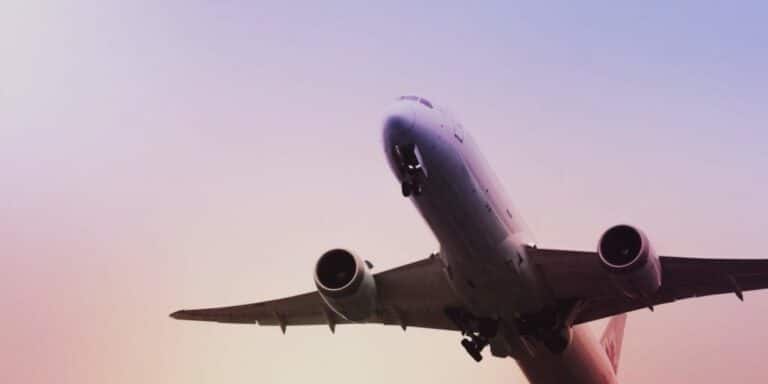 Underside of aircraft with its landing gear down, during takeoff