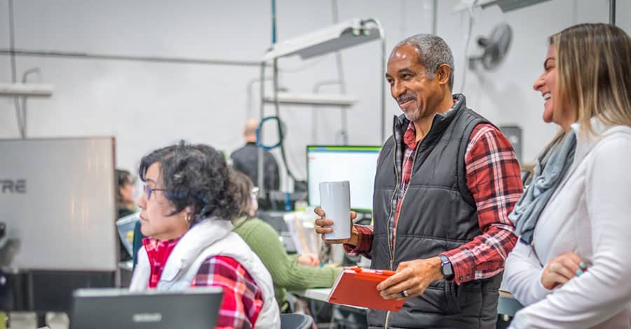 Employees working around computers and collaborating