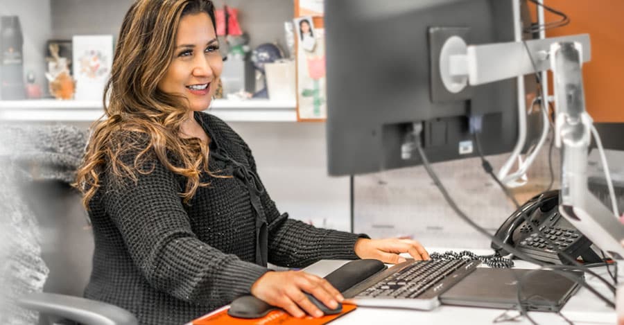 An employee works at a computer