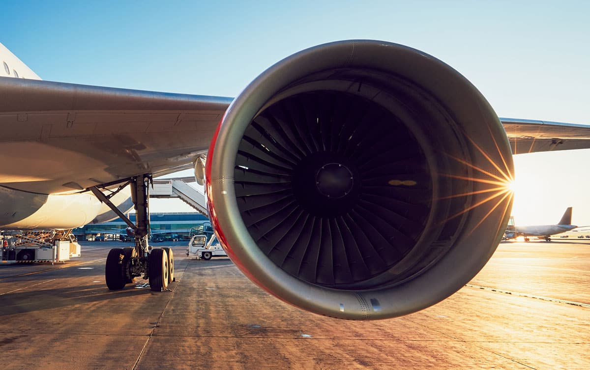 Jet engine on a white aeroplane, outside on the tarmac