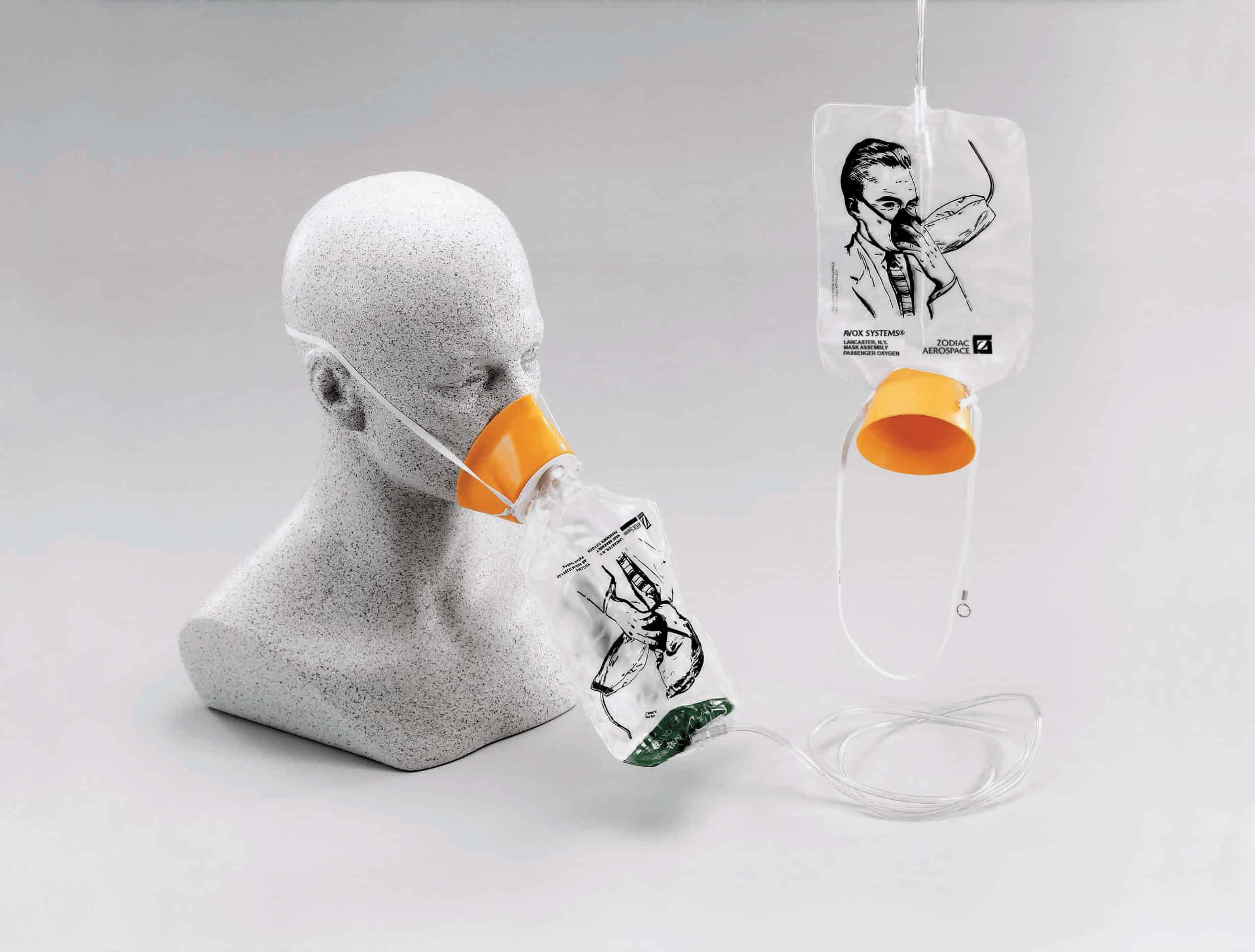 Aeroplane oxygen mask on a dummy head, to show how it fits